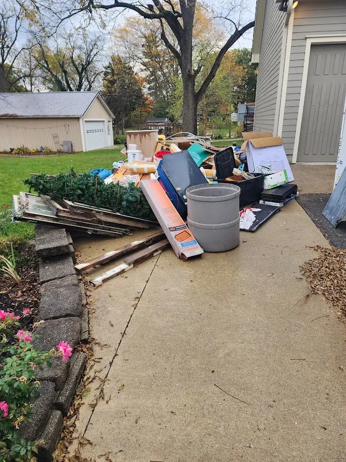 Dumpster being loaded with debris for 12 Yard Dumpster Rental in North Lebanon